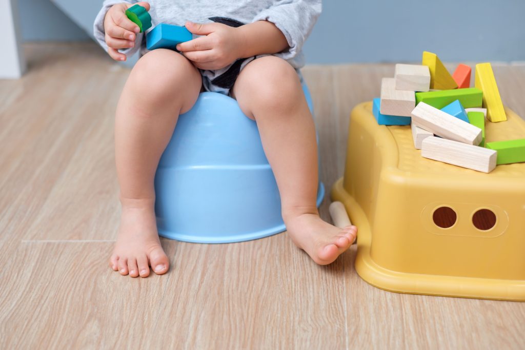 Closeup of legs of cute little Asian 18 months old toddler baby